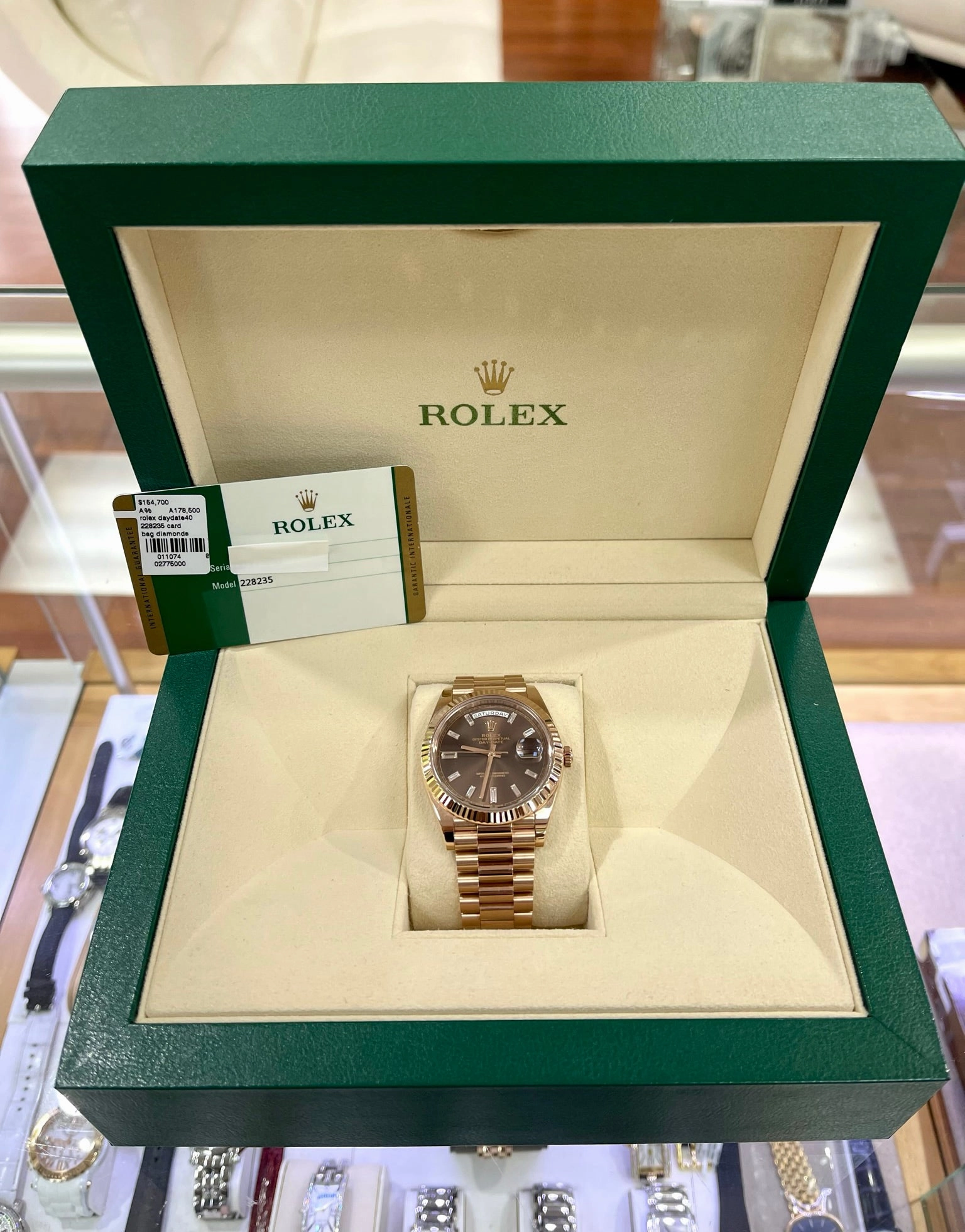 PreOwned Rolex Day-Date 40mm Everrose Gold 228235 Factory Chocolate Baguette Dial Box/Papers