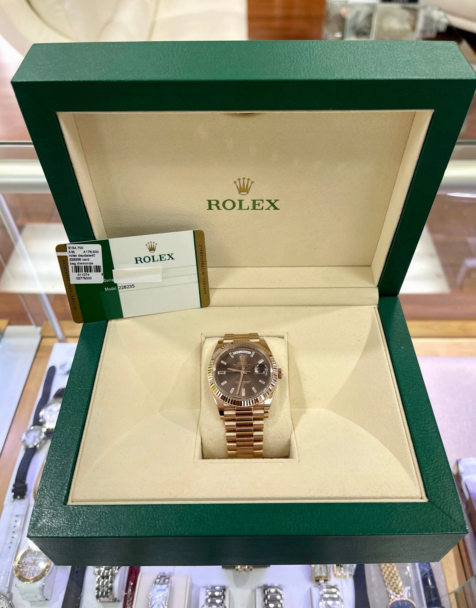 PreOwned Rolex Day-Date 40mm Everrose Gold 228235 Factory Chocolate Baguette Dial Box/Papers