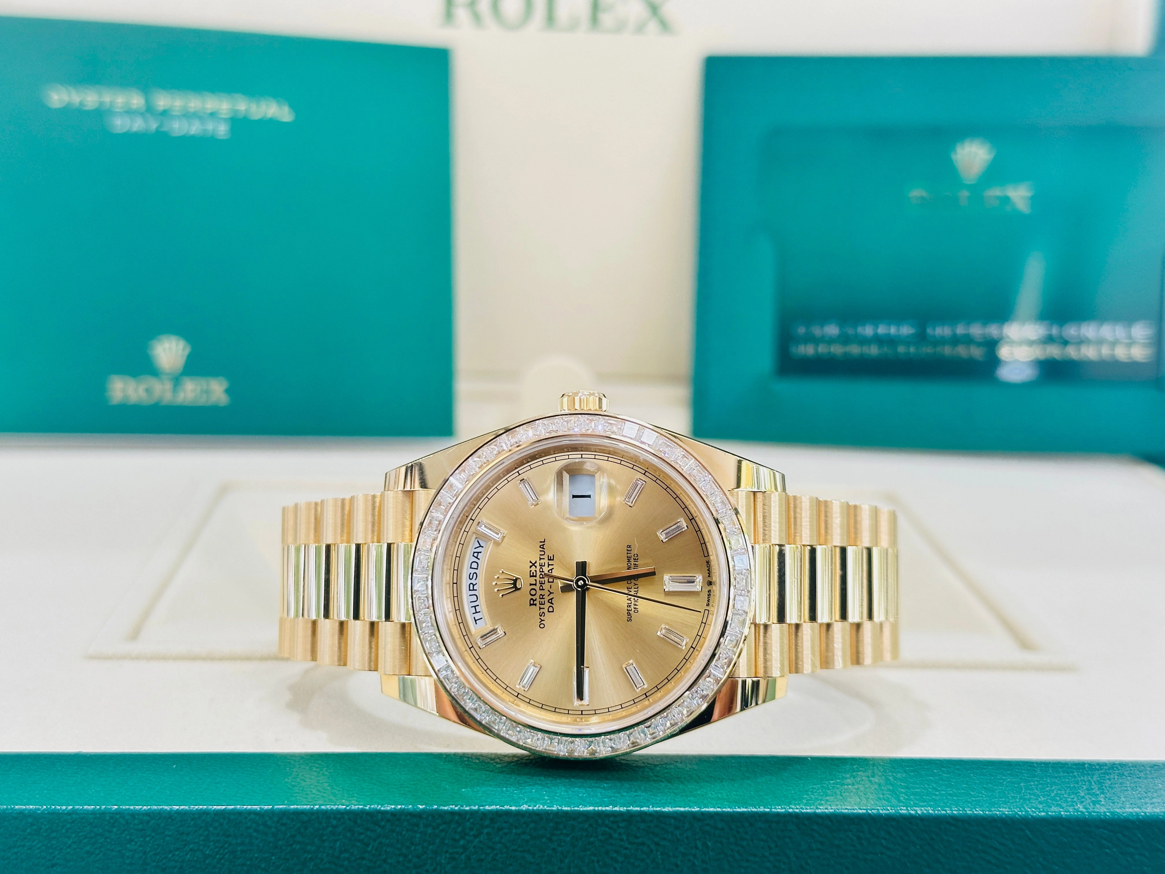 Rolex Day-Date 40 Yellow Gold Baguette Yellow gold Bezel  Factory Baguette Diamond Champagne Dial 228398TBR Box and Papers