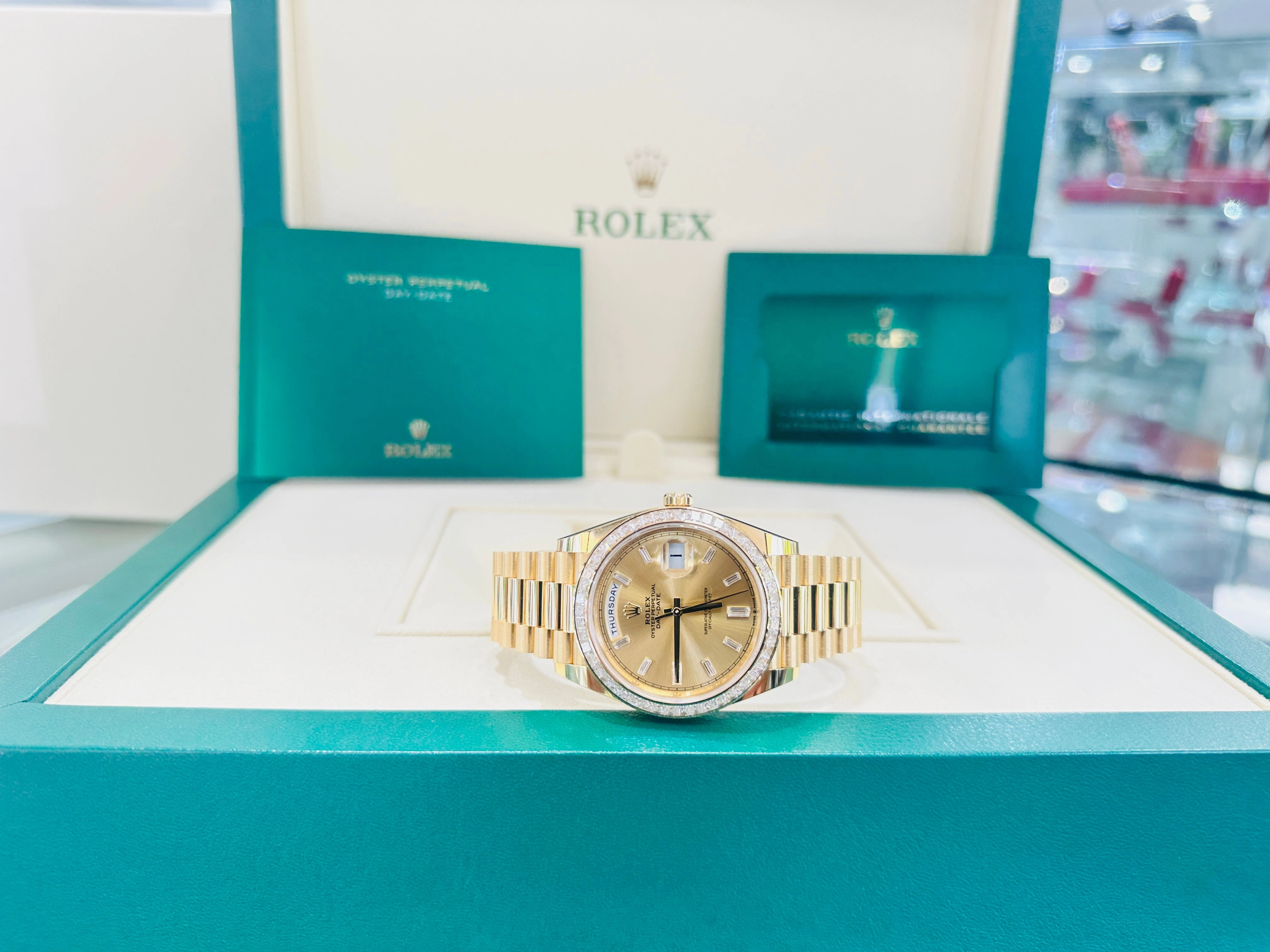 Rolex Day-Date 40 Yellow Gold Baguette Yellow gold Bezel  Factory Baguette Diamond Champagne Dial 228398TBR Box and Papers