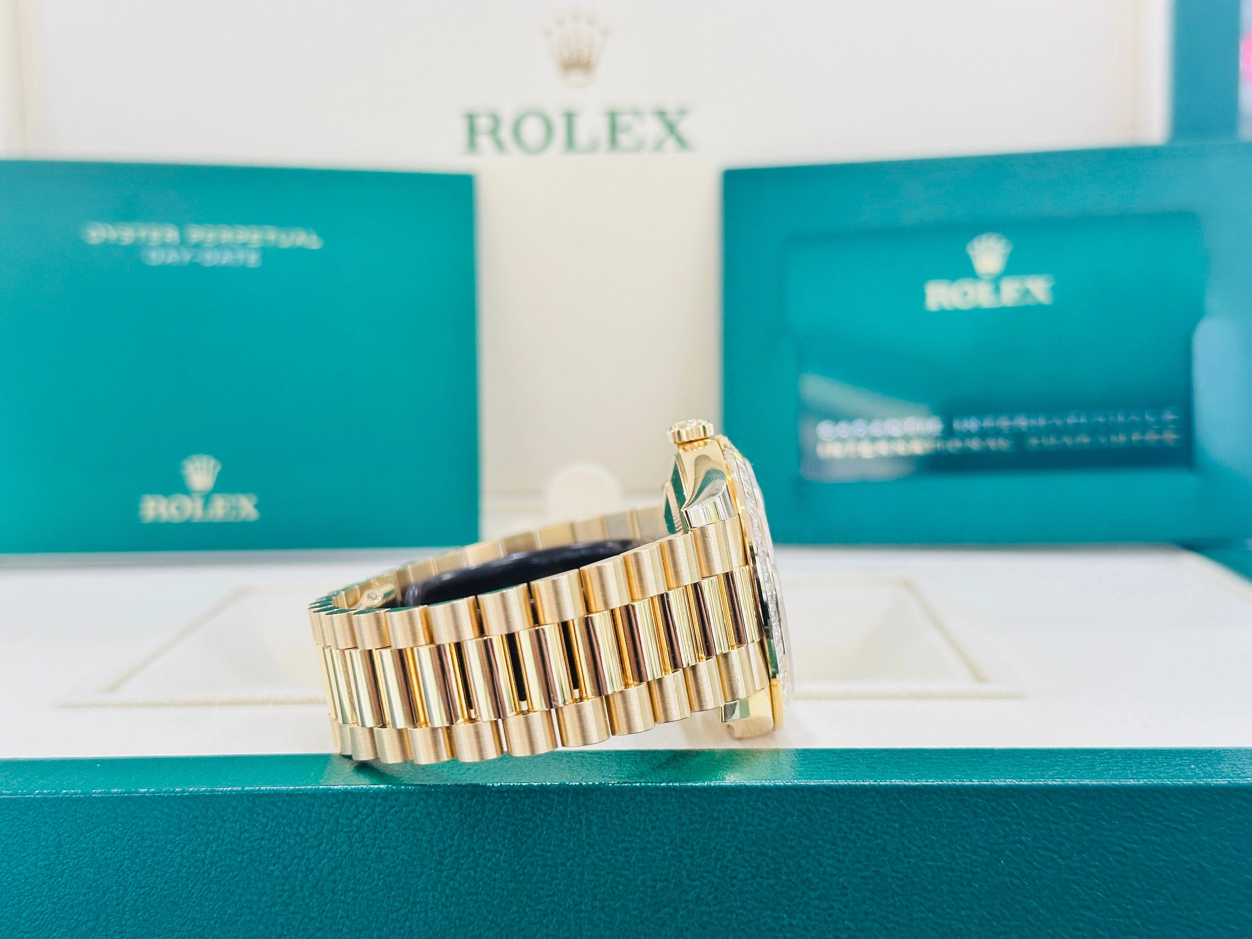 Rolex Day-Date 40 Yellow Gold Baguette Yellow gold Bezel  Factory Baguette Diamond Champagne Dial 228398TBR Box and Papers