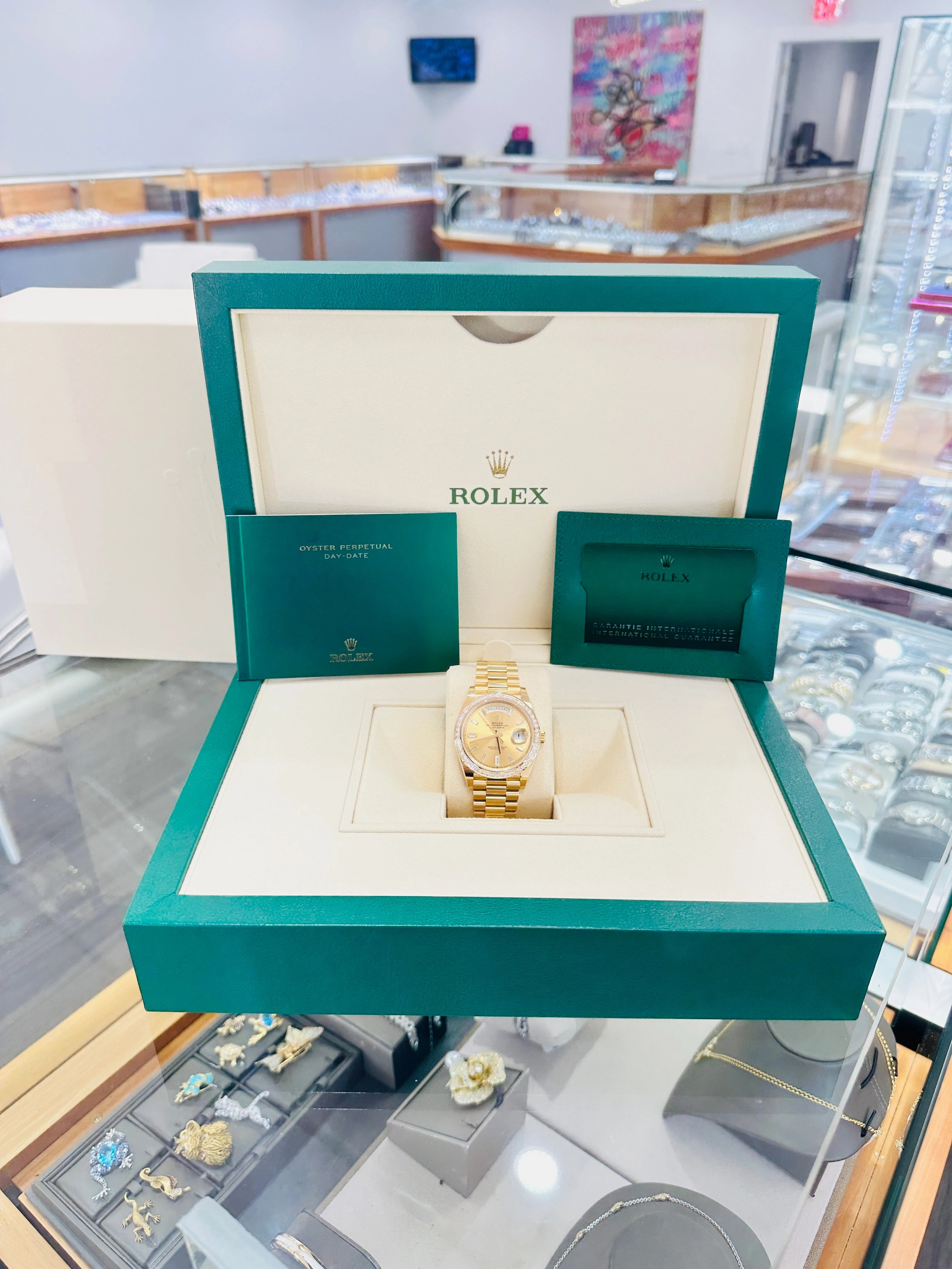 Rolex Day-Date 40 Yellow Gold Baguette Yellow gold Bezel  Factory Baguette Diamond Champagne Dial 228398TBR Box and Papers
